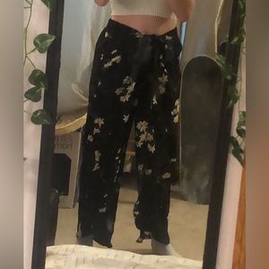 Black flowey pants with flower print, brand: Maurice’s, size xs